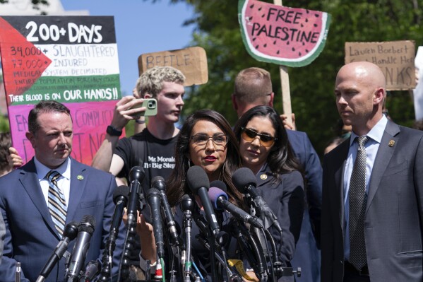 Rep. Lauren Boebert, R-Colo., accompanied other members of Congress speaks to the media after they toured the George Washington University students encampment as they protest over the Israel-Hamas war on Wednesday, May 1, 2024, in Washington. (AP Photo/Jose Luis Magana)